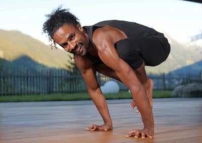 Yoga instructor doing crow yoga asana