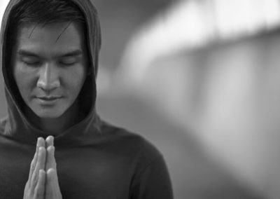 Yoga teacher doing Anjali Mudra